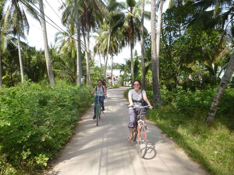 Mekong Day Tour by Car:Cai Be market, Local Island & Cycling - The Hand-Rowed Sampan Through Small Canals