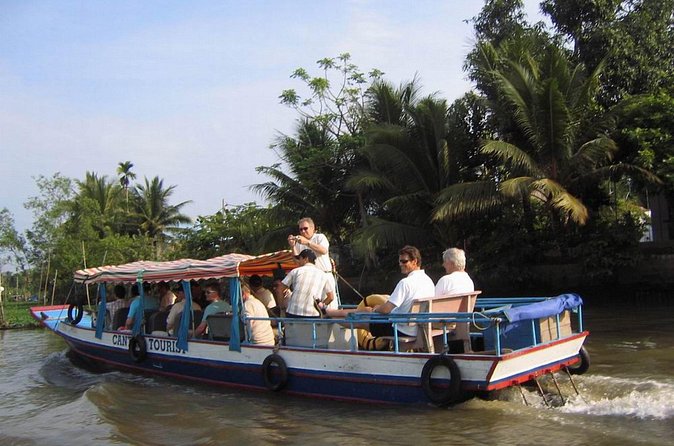 Mekong Delta full day trip - Hand-rowed sampans through narrow canals under coconut trees