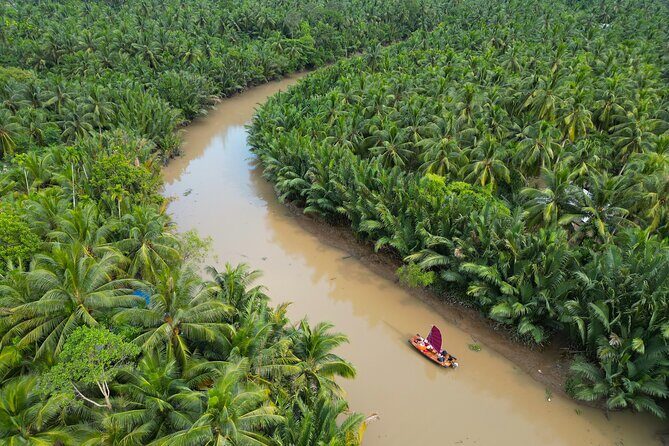 Mekong River Relaxing Sail boat cruise to Coconut Canals (1.5HRS) - Snacking and comfort: fried banana, water, and beanbags