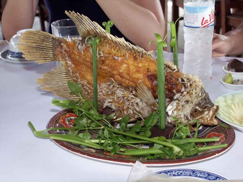 Private Cu Chi Tunnels & Mekong Delta: Full-Day Guided Tour - Rowboat on Small Waterways: Fruit, Coconut, and River Logic